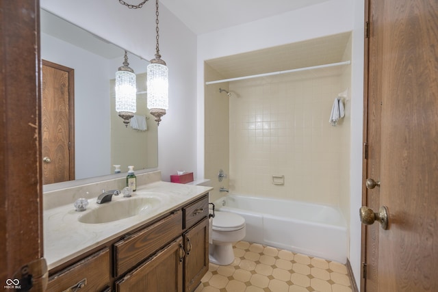 full bathroom with vanity, toilet, and tiled shower / bath