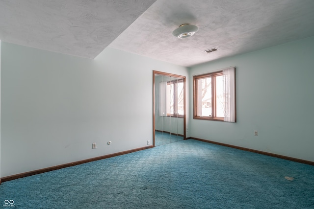 spare room with carpet