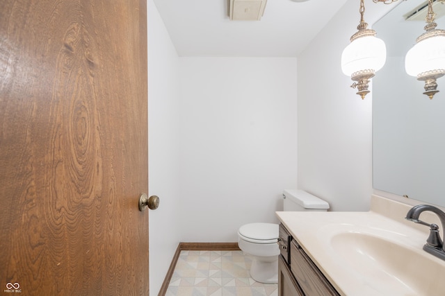 bathroom with vanity and toilet