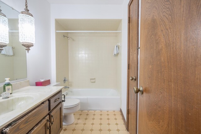 full bathroom with vanity, toilet, and tiled shower / bath