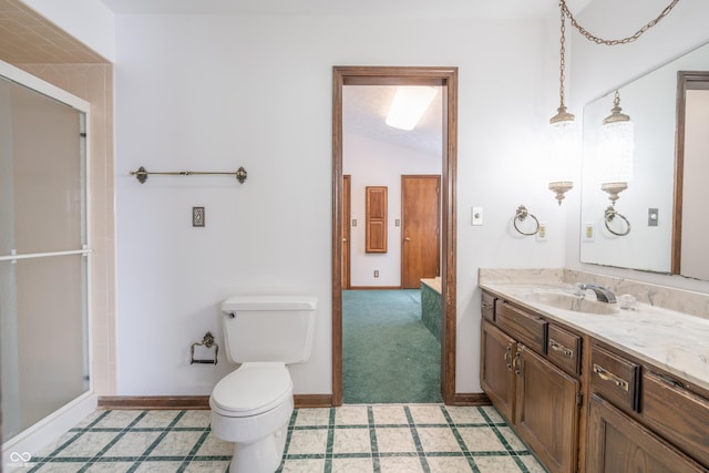 bathroom with vanity, lofted ceiling, toilet, and walk in shower