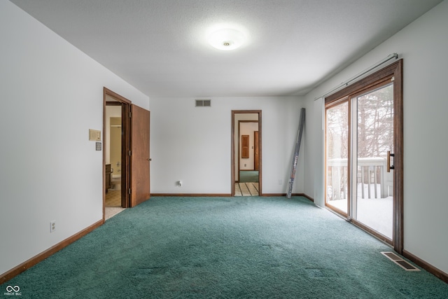 empty room with light colored carpet