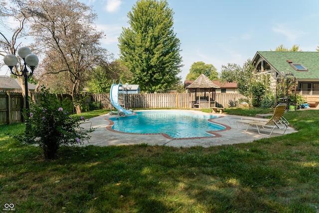 view of pool featuring a yard, a gazebo, a patio, and a water slide