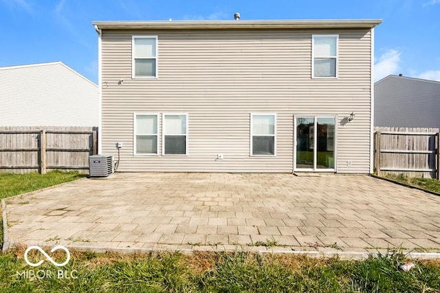 back of property featuring central AC and a patio