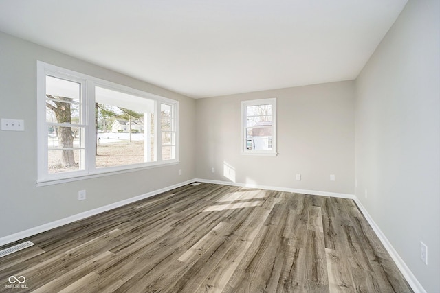 unfurnished room featuring wood-type flooring