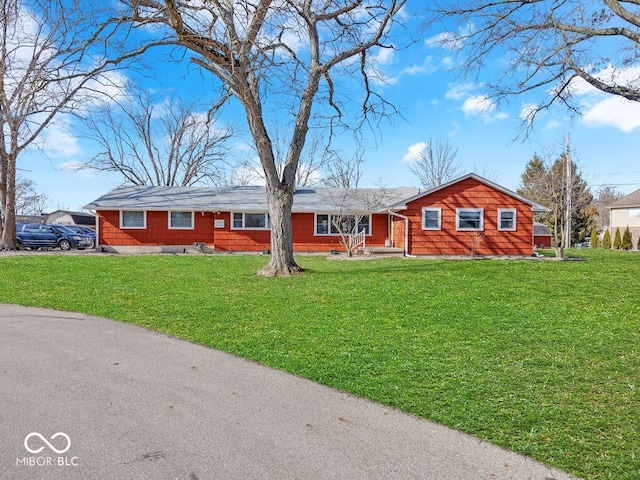 single story home featuring a front yard