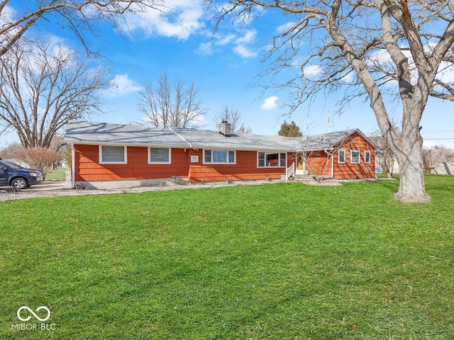 ranch-style home featuring a front yard