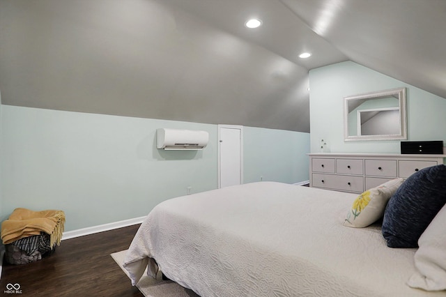 bedroom with dark wood-style flooring, lofted ceiling, recessed lighting, an AC wall unit, and baseboards