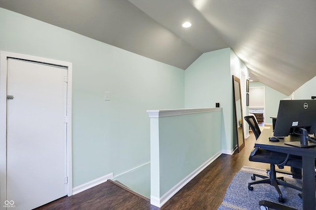 office space with lofted ceiling, recessed lighting, baseboards, and wood finished floors