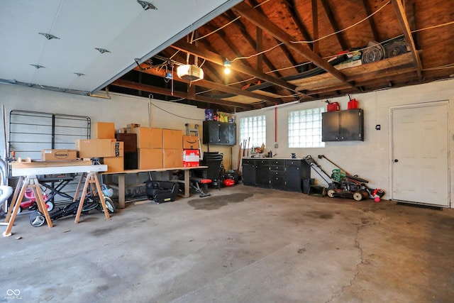 garage featuring a workshop area and a garage door opener