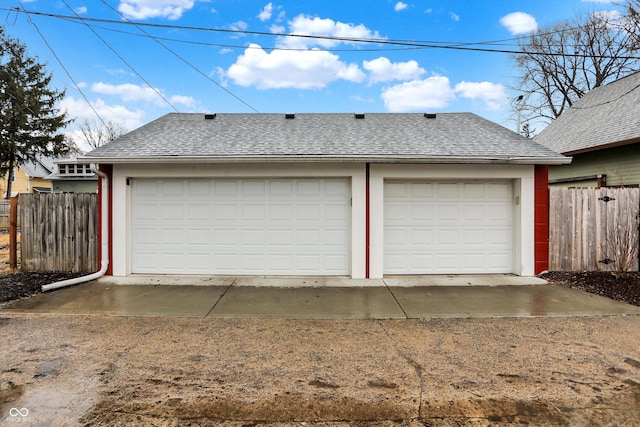 detached garage with fence