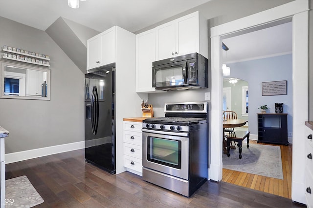 kitchen featuring dark wood-style floors, arched walkways, white cabinets, black appliances, and baseboards