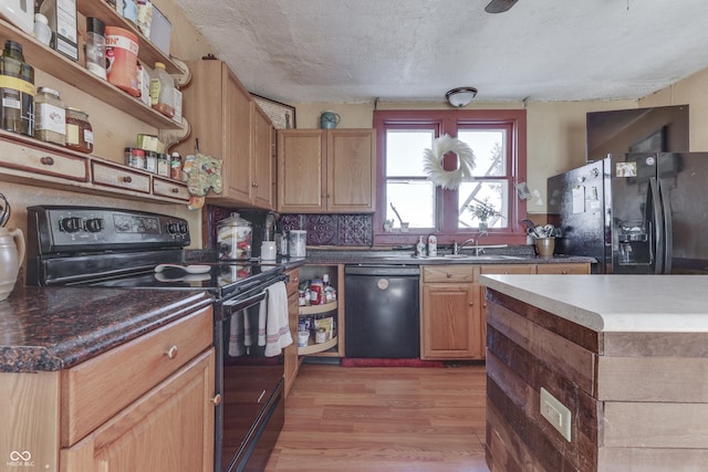 kitchen with sink, black appliances, a textured ceiling, light hardwood / wood-style flooring, and backsplash