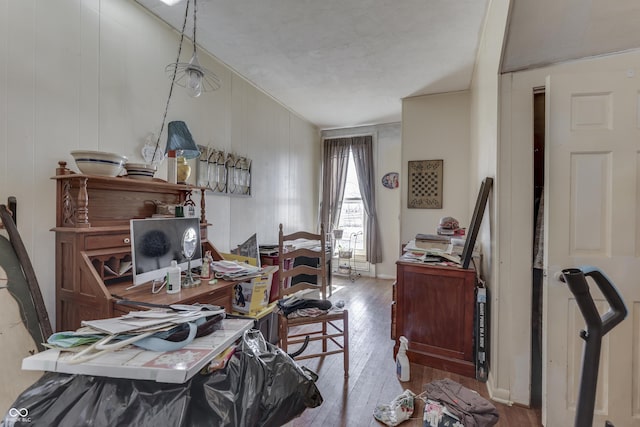 home office with wood-type flooring