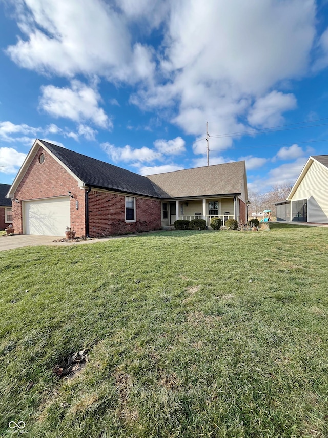 ranch-style house with a garage and a front yard