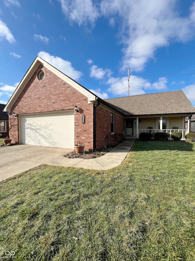 ranch-style home with a garage, covered porch, and a front yard