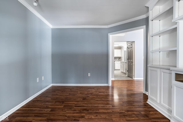 unfurnished room featuring dark wood-type flooring and ornamental molding