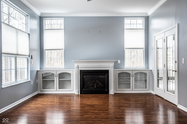 unfurnished living room with dark hardwood / wood-style flooring and ornamental molding