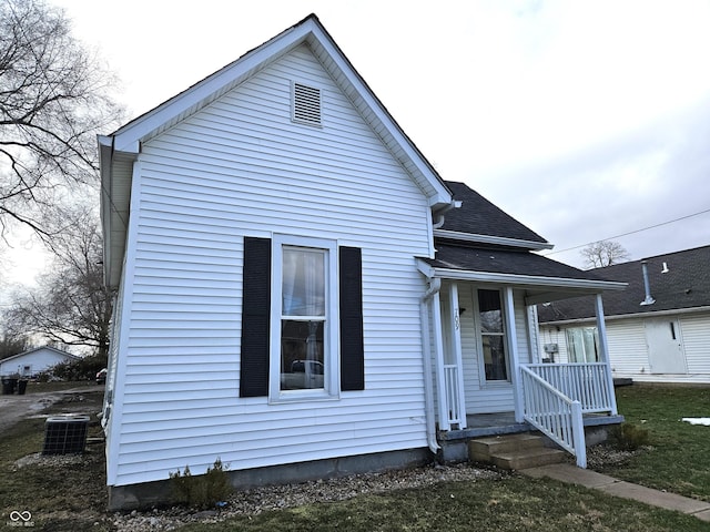 view of front facade with cooling unit and covered porch