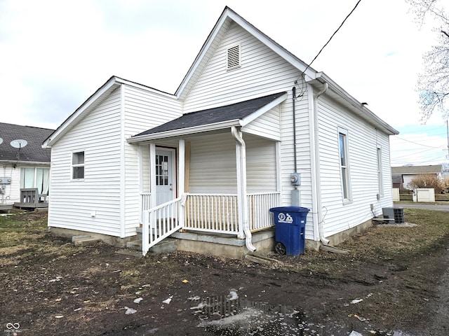 view of front of property with central AC and a porch