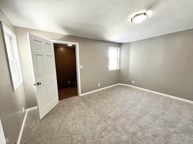 unfurnished bedroom with carpet