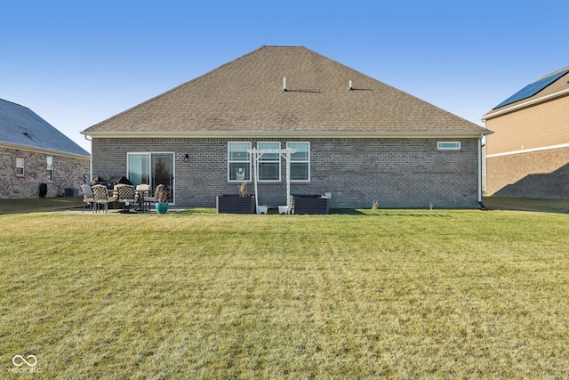 rear view of property with central AC unit, a lawn, and a patio area