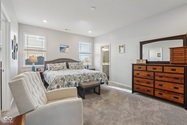 carpeted bedroom with ensuite bath