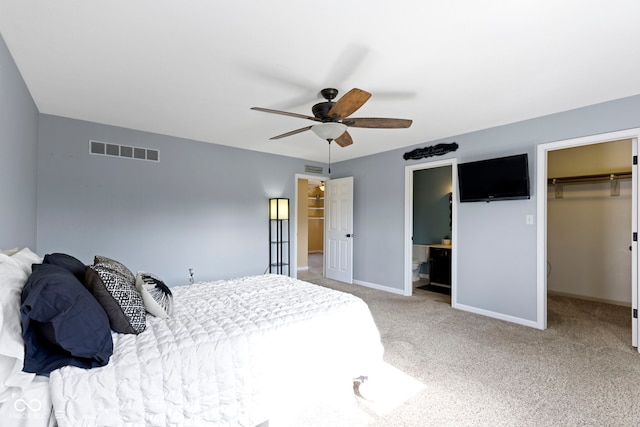 956 Dorchester Dr, Noblesville, IN 46062 - carpeted bedroom with a walk in closet, a closet, baseboards, and ceiling fan