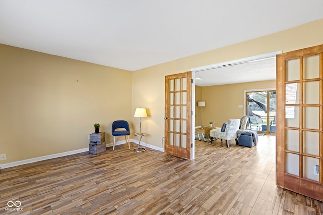 956 Dorchester Dr, Noblesville, IN 46062 - living area featuring wood finished floors, french doors, and baseboards