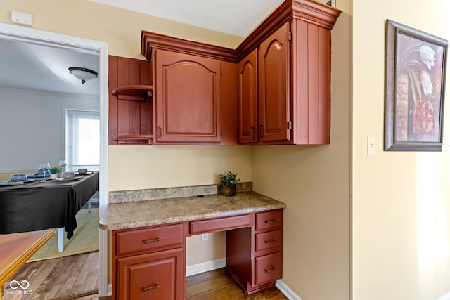 956 Dorchester Dr, Noblesville, IN 46062 - kitchen featuring open shelves, light countertops, wood finished floors, and crown molding