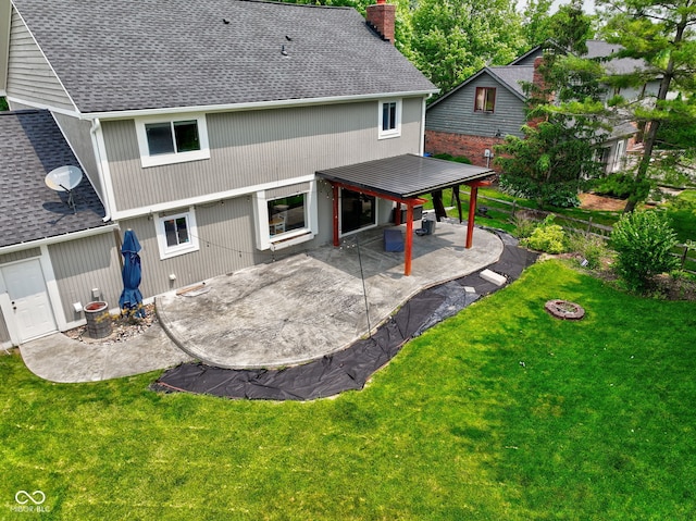 956 Dorchester Dr, Noblesville, IN 46062 - rear view of property with a chimney, a shingled roof, and a patio
