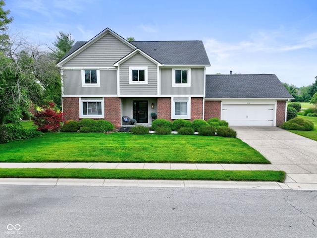 956 Dorchester Dr, Noblesville, IN 46062 - view of front facade featuring brick siding, an attached garage, and driveway