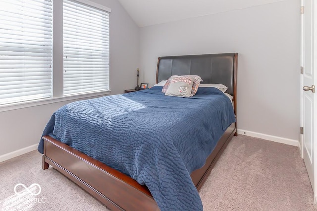 bedroom featuring carpet floors and vaulted ceiling