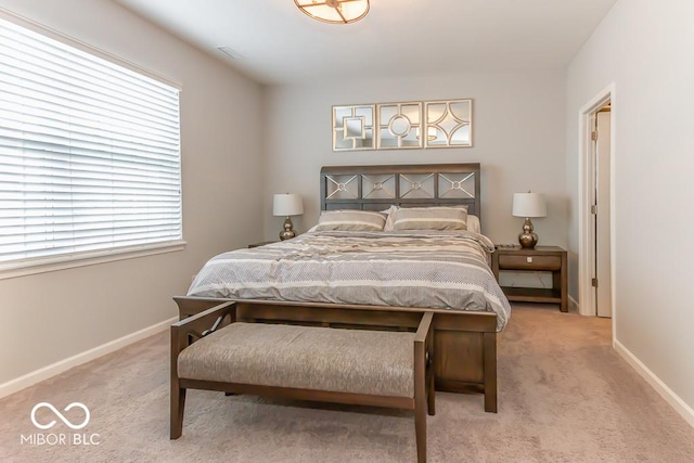 bedroom featuring light colored carpet