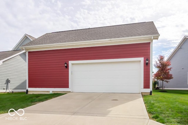 view of front of house with a garage and a front lawn