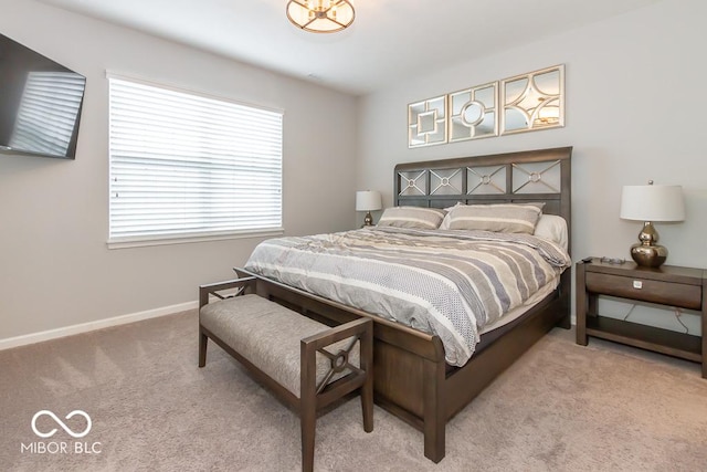 bedroom with light colored carpet