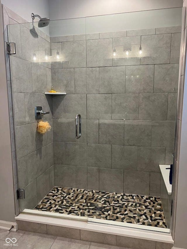 bathroom featuring a shower with door