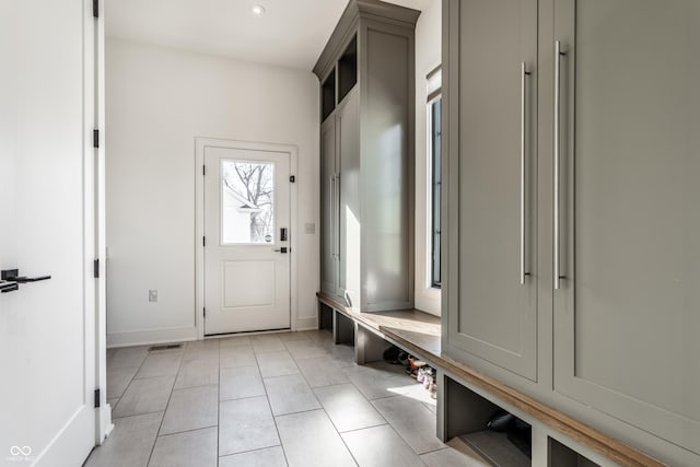 mudroom with light tile patterned floors