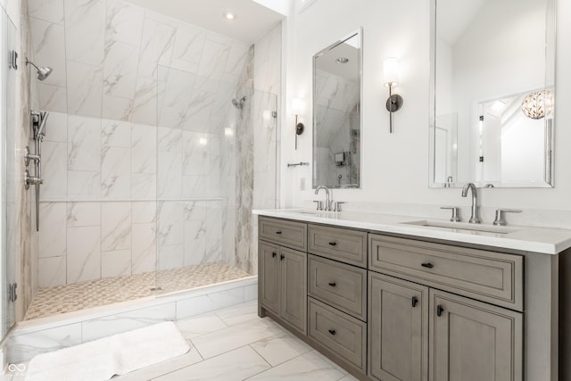 bathroom featuring vanity and tiled shower