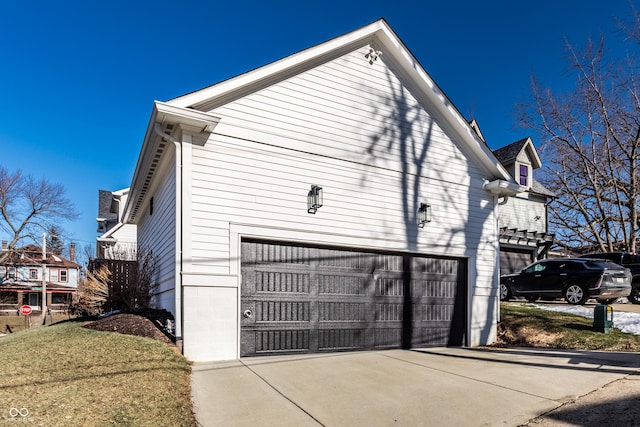 view of home's exterior featuring a yard and a garage