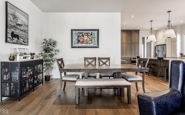 dining area with dark hardwood / wood-style floors