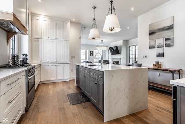 kitchen featuring pendant lighting, sink, gray cabinets, appliances with stainless steel finishes, and white cabinetry