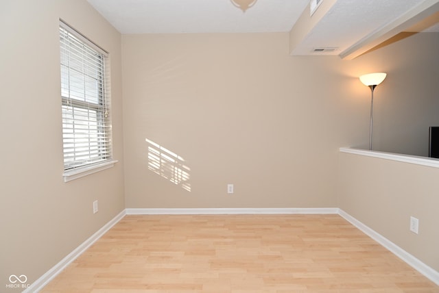 unfurnished room featuring light hardwood / wood-style flooring