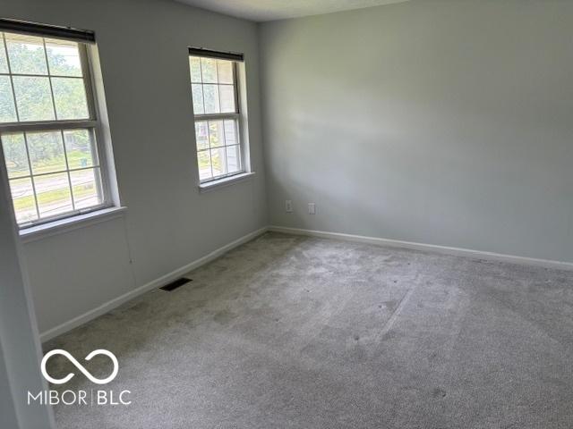 6639 N College Ave, Indianapolis, IN 46220 - empty room featuring carpet flooring and baseboards