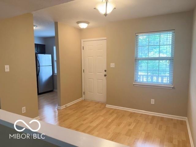 6639 N College Ave, Indianapolis, IN 46220 - entryway with light wood-type flooring and baseboards