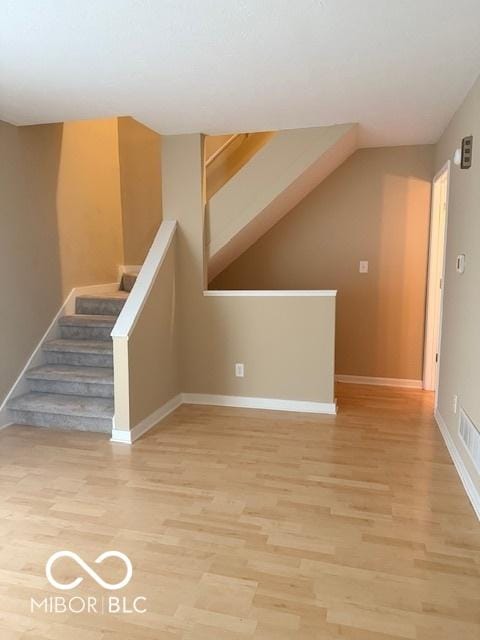 6639 N College Ave, Indianapolis, IN 46220 - staircase featuring wood finished floors and baseboards
