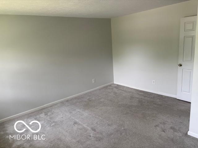 6639 N College Ave, Indianapolis, IN 46220 - carpeted spare room with baseboards
