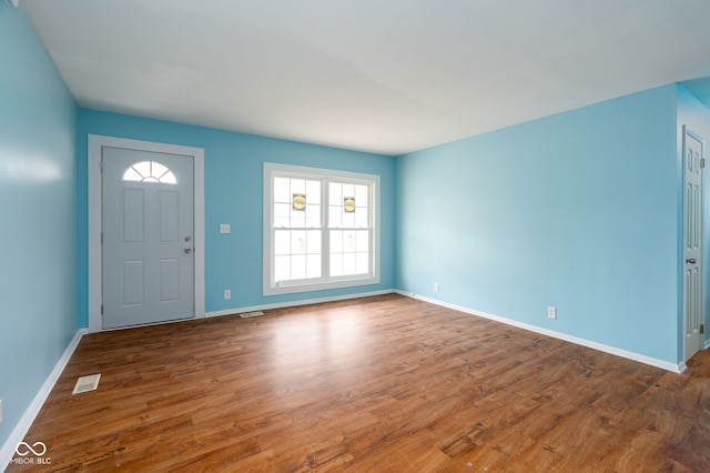 foyer entrance with hardwood / wood-style flooring