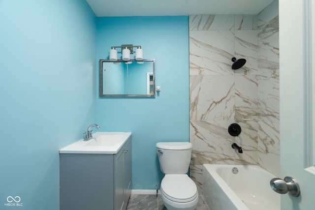 full bathroom with vanity, tiled shower / bath combo, and toilet