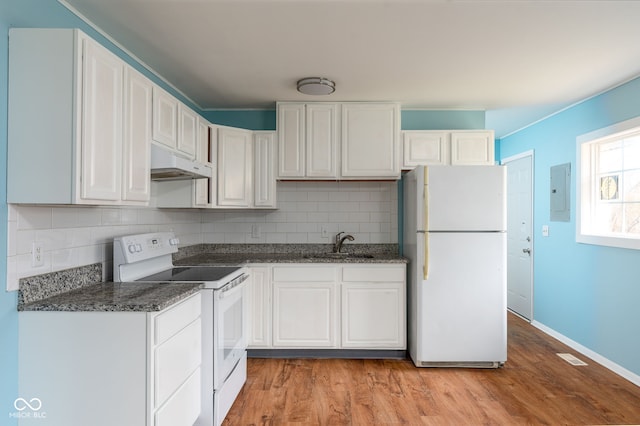 kitchen with white cabinetry, sink, white appliances, and light hardwood / wood-style floors